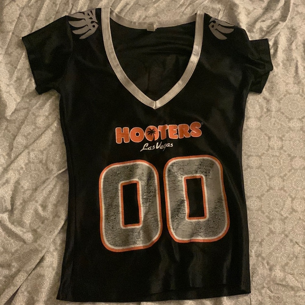 Hooters Jersey in a small black. 3 in a medium.